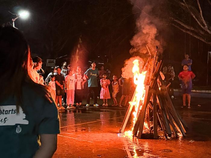 Having campfire with the local youth