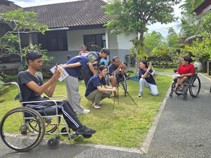 Volunteers co-creating short videos with individuals with physical disabilities