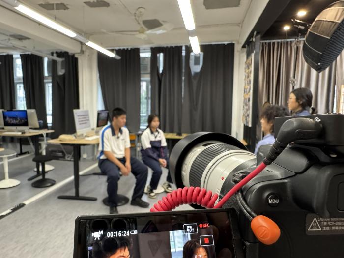 Participants conducting an interview at a secondary school