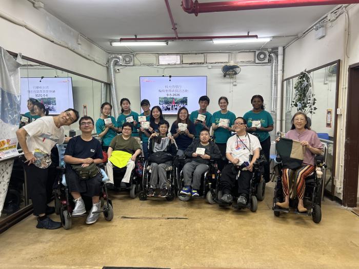 Students distributing cushion covers to the wheelchair users