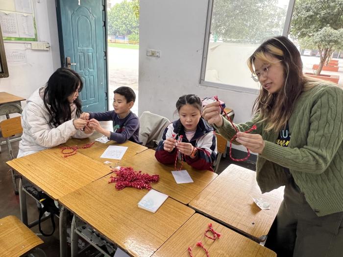Trip participants teaching students