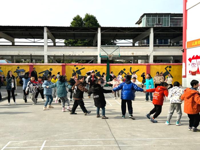 Volunteers and kids building bonds through games.