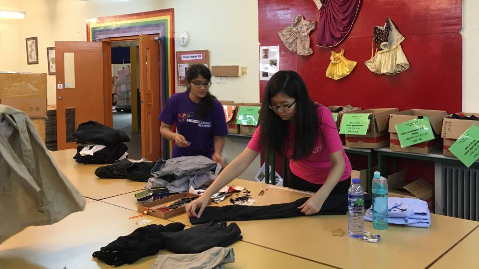 Tidying up and packing donated clothes