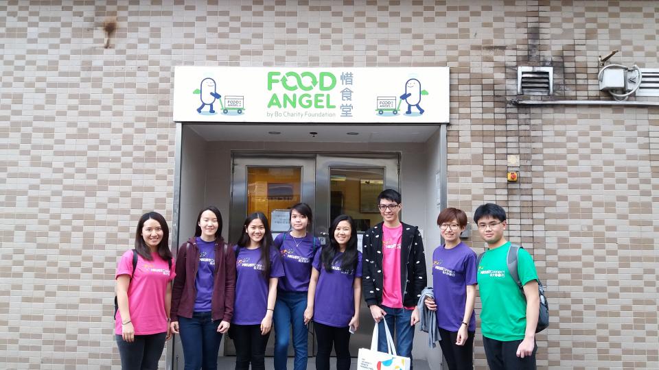 Taking a group photo at Food Angel Community Kitchen