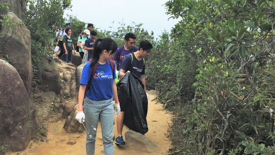 Picking up litter along the hiking track