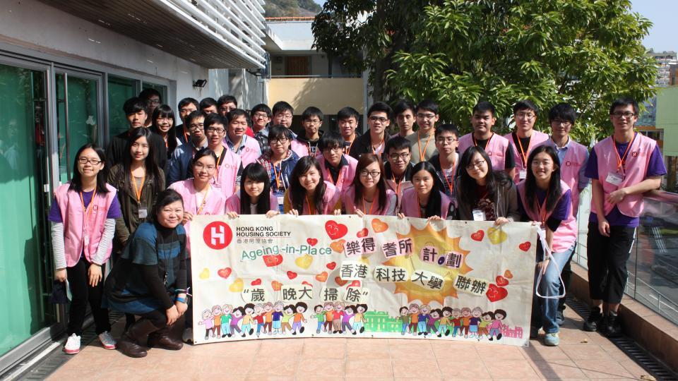 A group photo of volunteers and staff before service