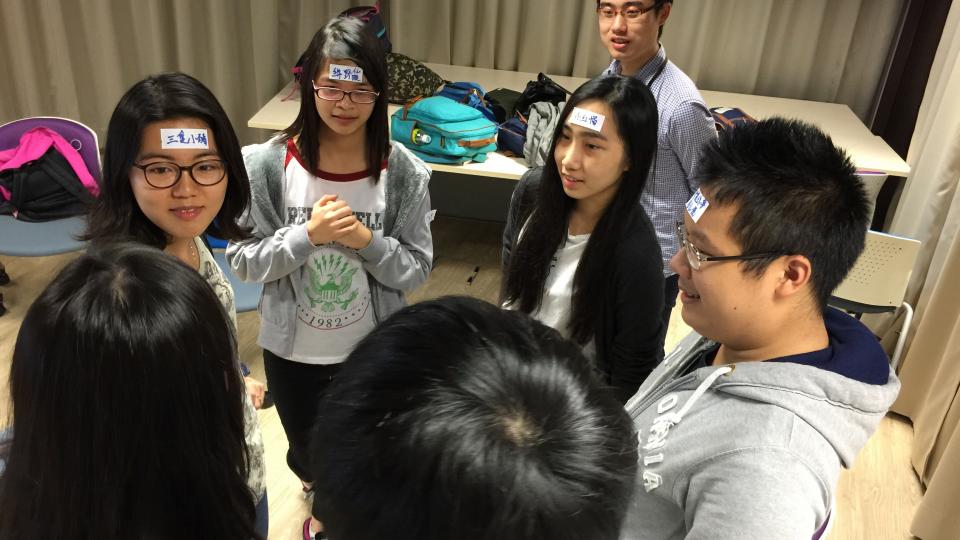Volunteers playing ice breaking game before service