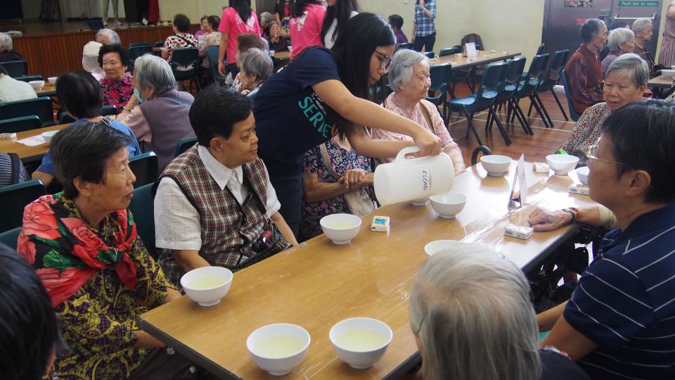 Student volunteers serving the soup