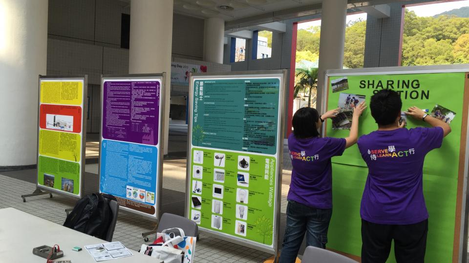 Volunteers setting up the booth in the Atrium