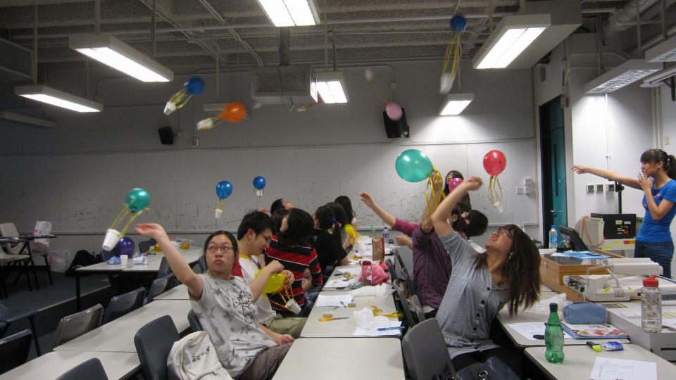 Volunteers testing out and refining their teaching experiments before departure