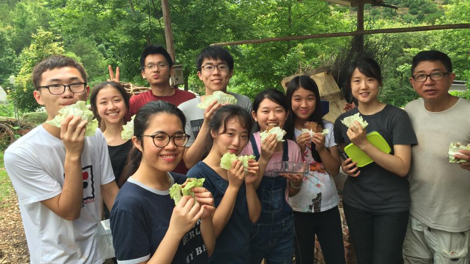 The team visiting the organic farm and enjoying a delicious lunch