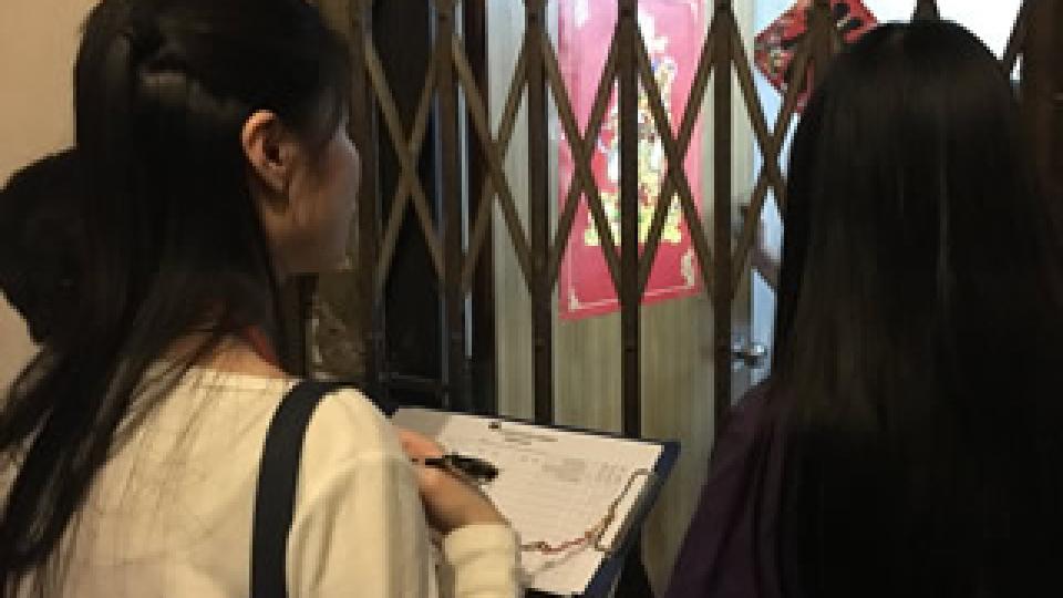 Volunteers recording the needs of household living in subdivided unit
