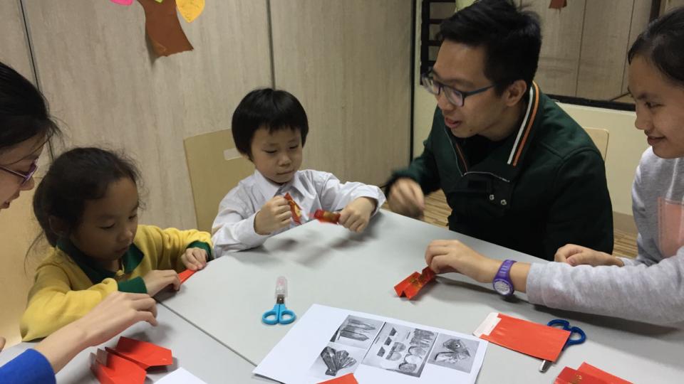 Volunteers teaching children with their homework