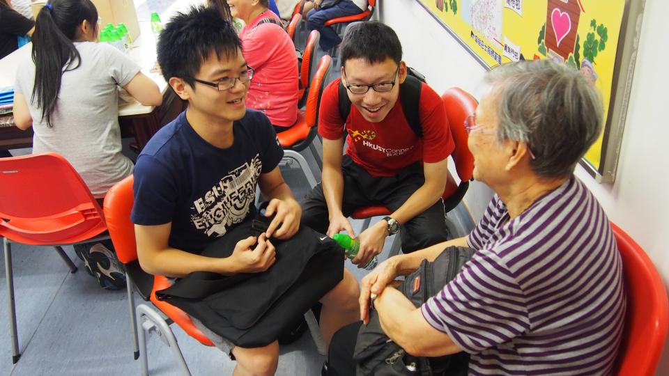 Volunteers interacting with the elderly