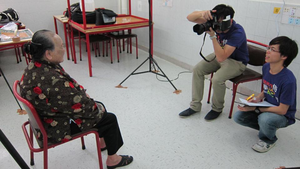 volunteers taking photos for older people