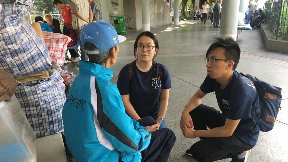 Volunteers talking to a street sleeper
