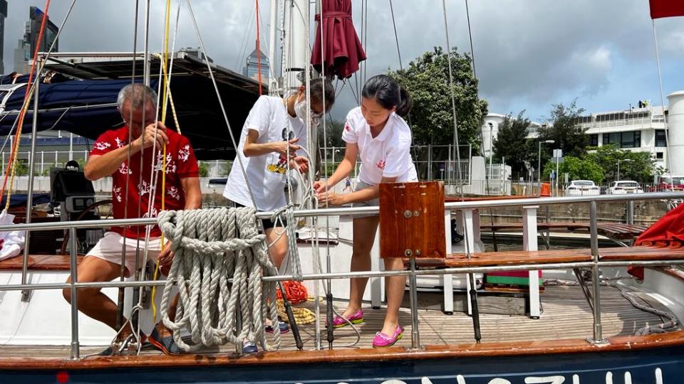 students serving on the yacht