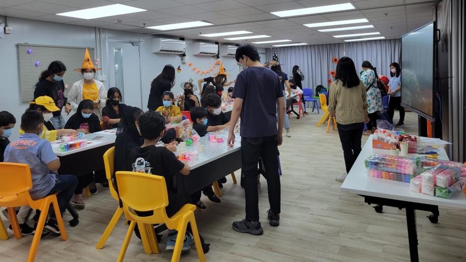 Volunteers having fun with EM kids