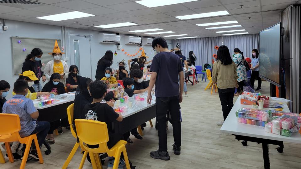 Volunteers having fun with EM kids