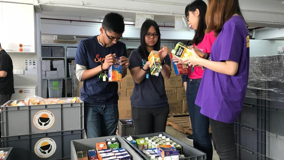 Volunteers packing donated food