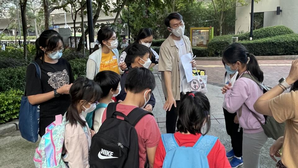 Kids and volunteers doing mission tasks in the neighborhood