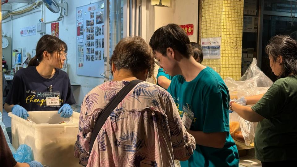 Volunteers redistributing food to people in need