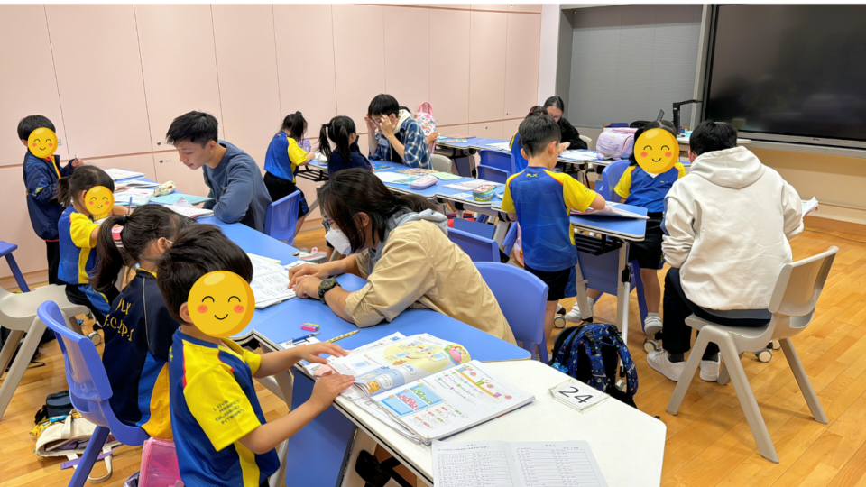 Volunteers assisting students with their homework