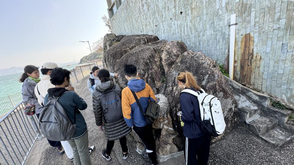 Volunteers checking the condition of rocks before cleaning