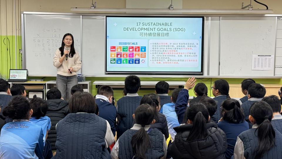 A volunteer introducing SDG Goals to the students