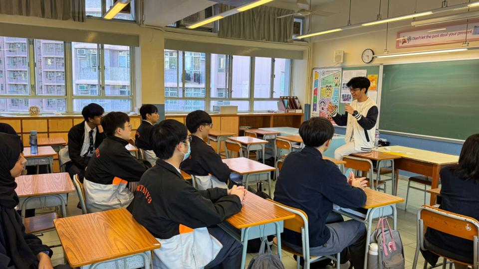 Volunteer sharing his views with secondary students