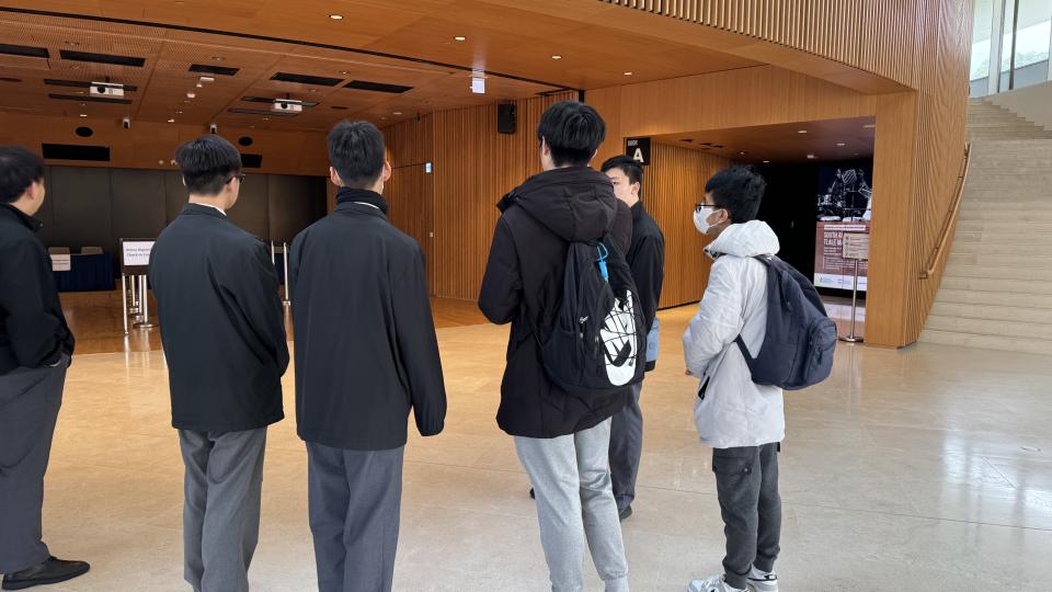 Volunteer introducing campus facilities to students