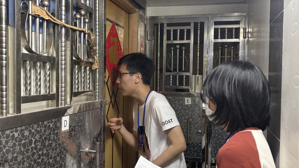 Volunteers conducting door-to-door visits in subdivided flats in the Sham Shui Po district