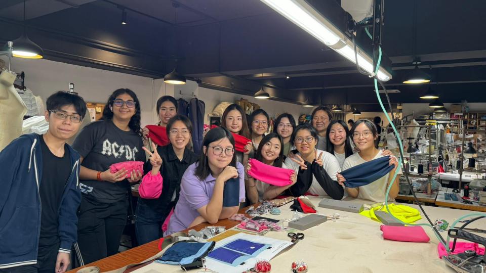 Group photo of mass production day in sewing studio