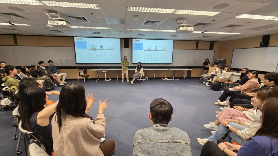 Students learning basic Hong Kong Sign Language from a deaf instructor