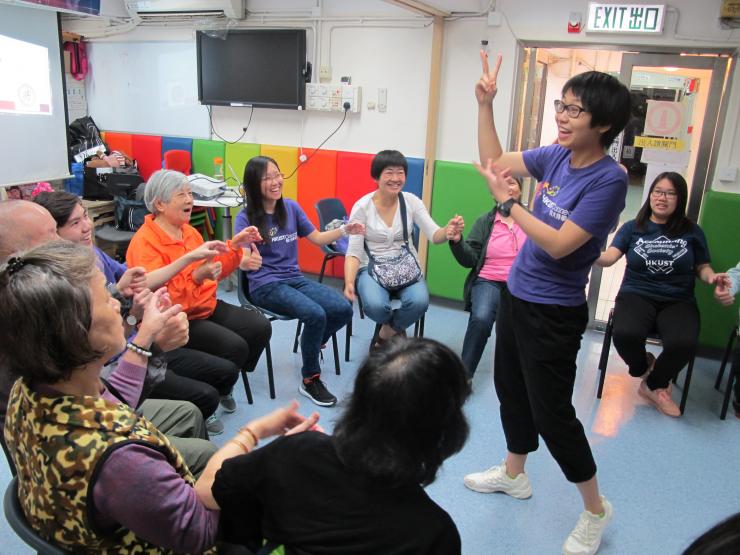Student leaders playing games with the elderly