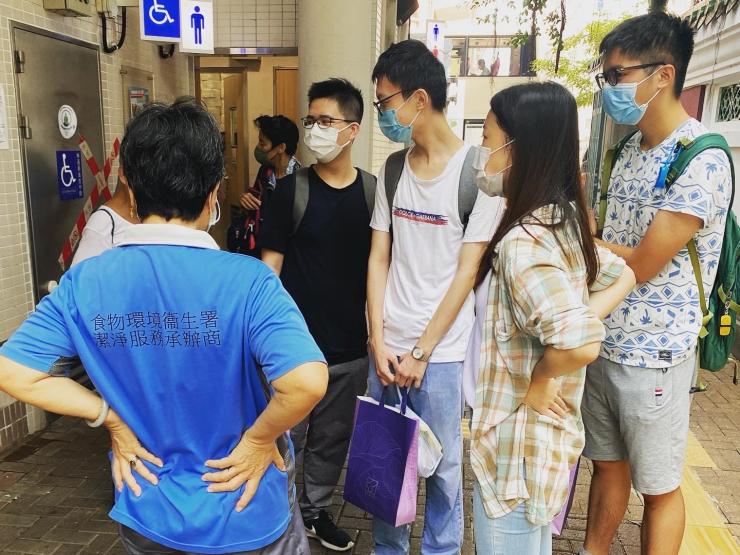 Volunteers with street cleaners