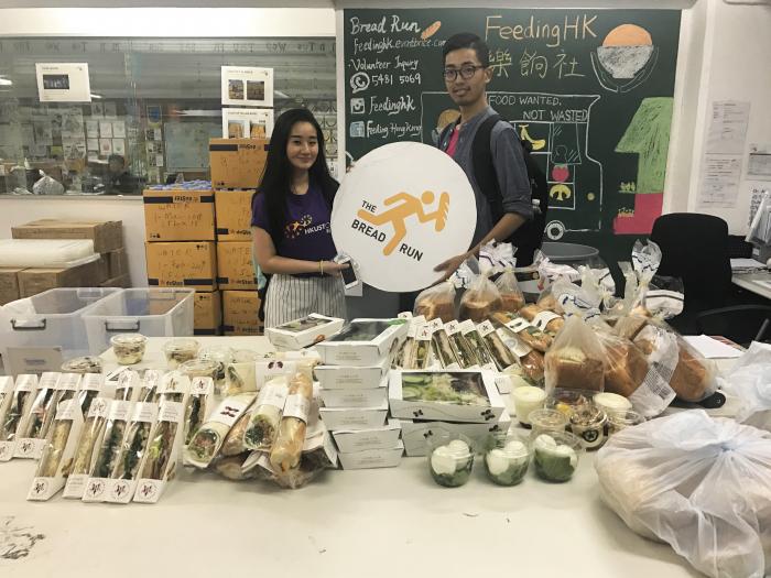 Volunteers bringing bread surplus back to the warehouse