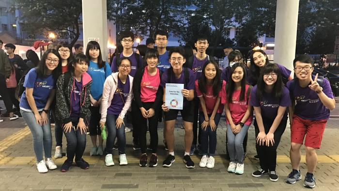 Taking a group photo after visiting the homeless