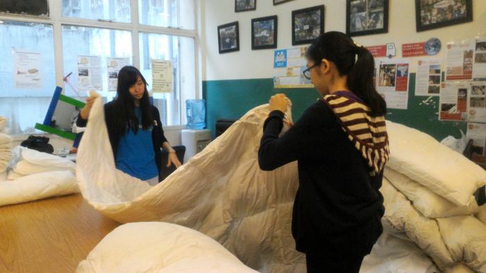 Volunteers checking the quality of the donated blankets