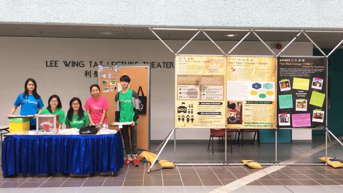 Volunteers setting up an exhibition for fund-raising