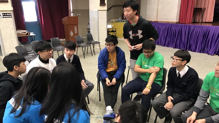 Volunteers sharing their experience with the teenagers