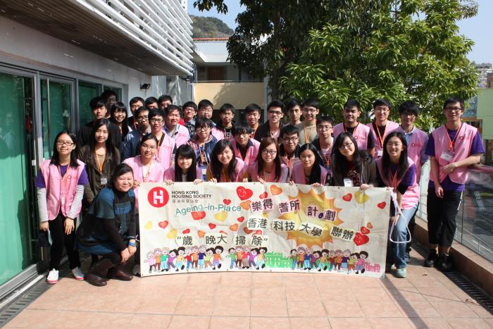A group photo of volunteers and staff before service