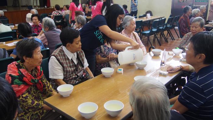 Student volunteers serving the soup