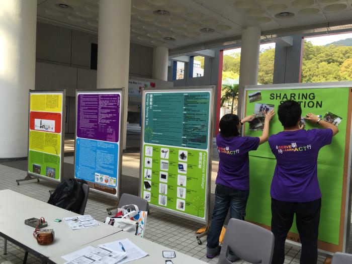 Volunteers setting up the booth in the Atrium