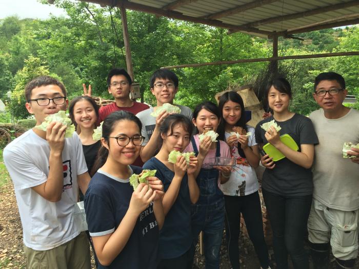 The team visiting the organic farm and enjoying a delicious lunch