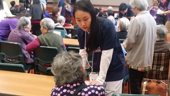 Volunteers interacting with the edlerly