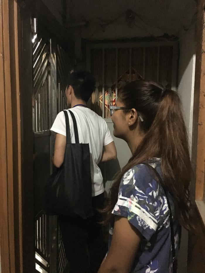 Volunteers approaching a household living in a subdivided housing unit
