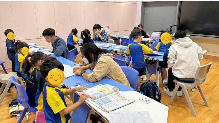 Volunteers assisting students with their homework