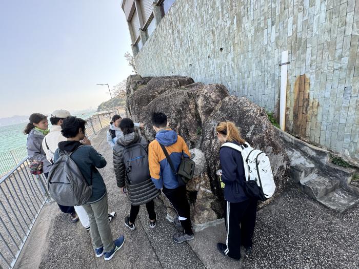 Volunteers checking the condition of rocks before cleaning