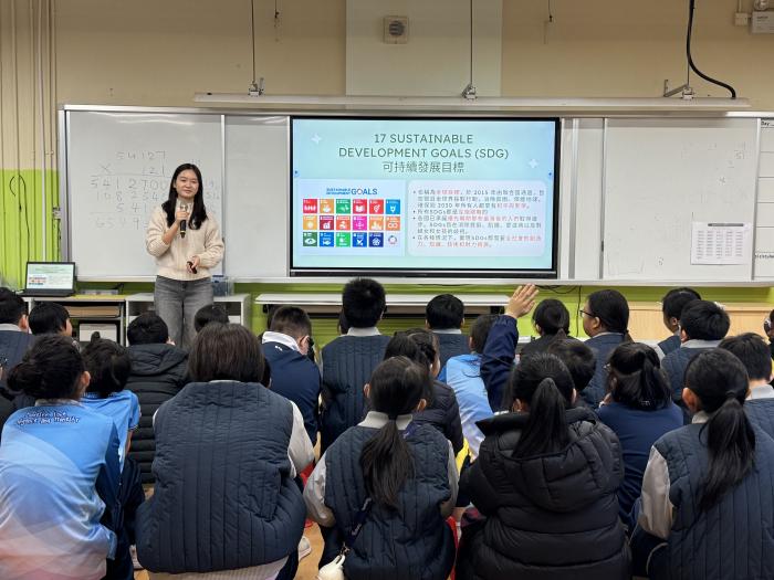 A volunteer introducing SDG Goals to the students